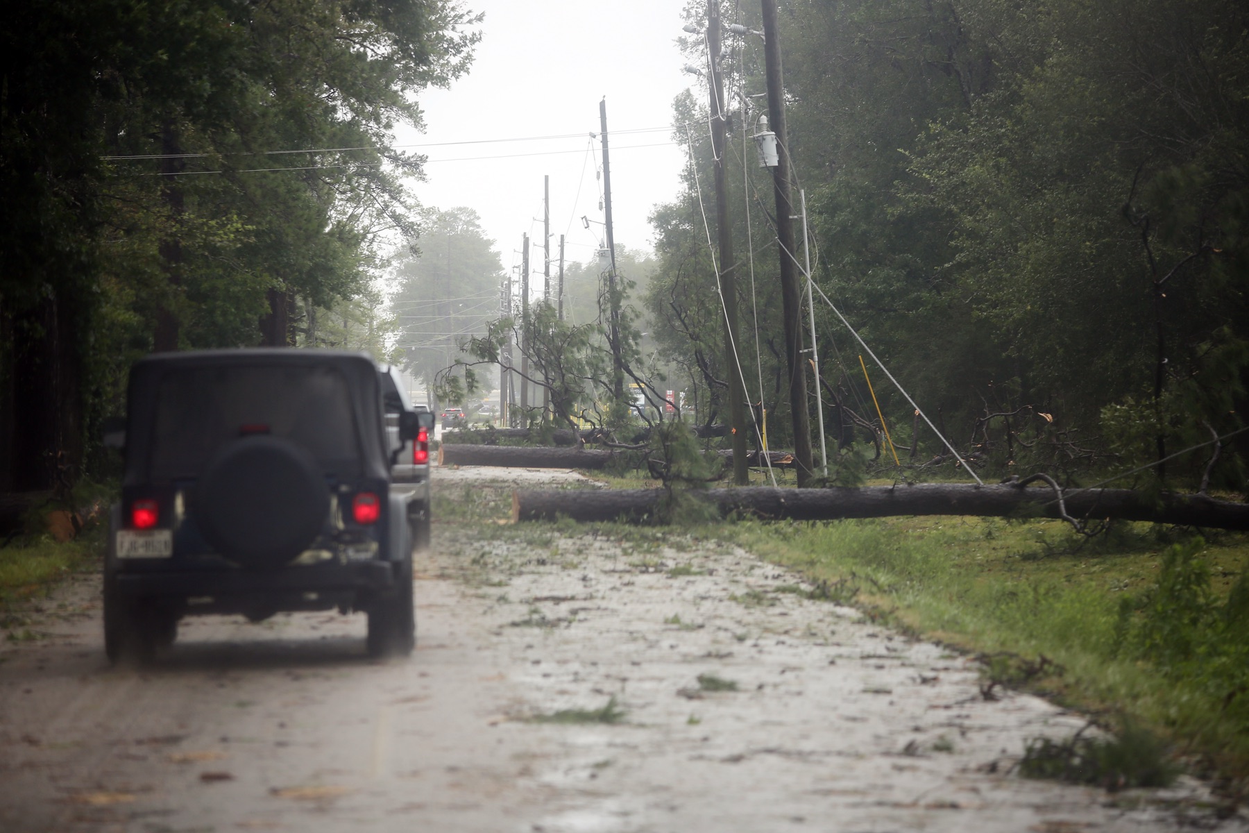 Downed power lines near New Caney, TX, after Hurricane Beryl