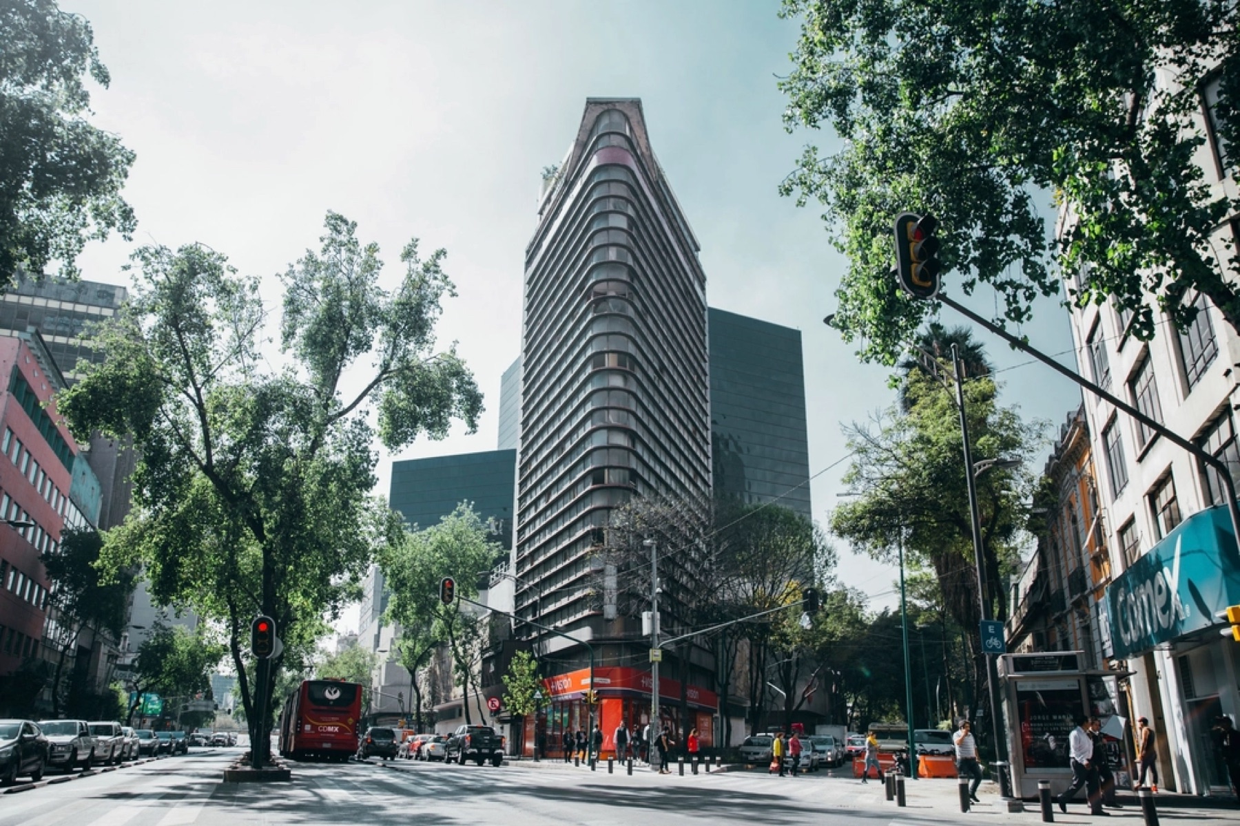 Glass office building busy city